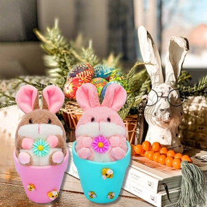 Set of two plush Easter bunnies in ceramic pots with daisies for home festive decoration