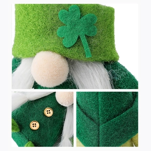 Macro shot of St. Patrick's Day gnome featuring a green felt hat with clover and gold buttons