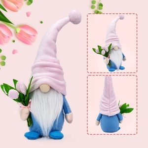 Macro detail of gnome plush with pink velvet hat, white beard and tulip flower decoration