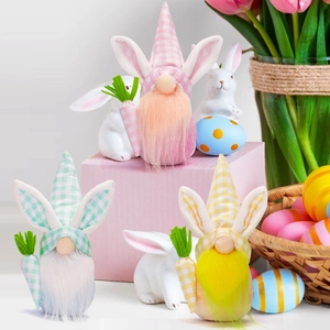 Three Easter gnomes with bunny ears and carrots in pink, green, and yellow colors