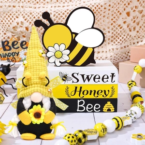 Close-up of a honey bee gnome figurine with sweet honey bee decorative wooden blocks