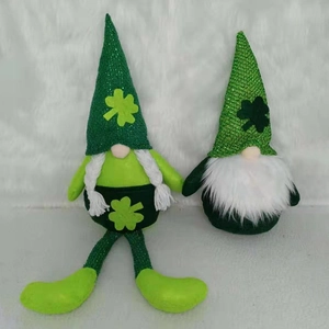St. Patrick's Day gnome plush duo with green shamrock hats on white faux fur background