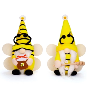 Pair of bee themed gnomes with yellow hats, sunflower accents and honey jars for decor