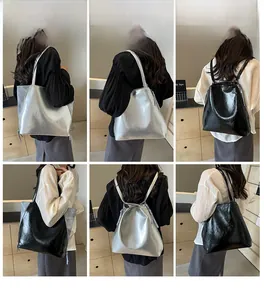 Detailed views of high-capacity tote bags with tassels in silver and black finishes