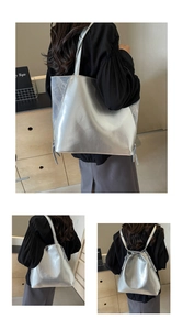 Detail of silver metallic tote bag showing versatile shoulder and backpack carry styles