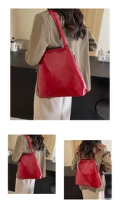 Detailed view of glossy red leather tote bag with convertible straps in daily setting