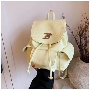 Detail of light yellow lychee pattern PU leather backpack with drawstring and metal B logo