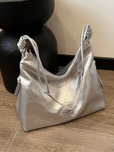 Metallic silver large tote bag with textured finish and knotted shoulder strap details