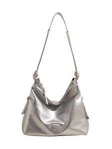 Silver metallic crescent hobo bag with a unique knot shoulder strap and large capacity