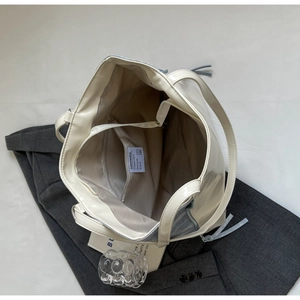 Close-up of contrast color tote bag showing internal zipper pocket and stitching