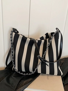 Striped knit canvas shoulder bag with leather strap and silver metal chain accessory