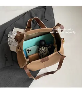 Spacious interior of a large tote bag with sections for laptop and daily essentials