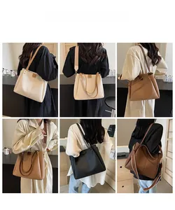 Detailed views of high-capacity tote bag with wide strap and pebble leather texture