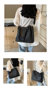 Detail of black lychee grain tote bag with adjustable straps for various carrying styles