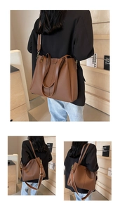Detailed macro view of brown lychee grain leather tote with wide striped shoulder strap