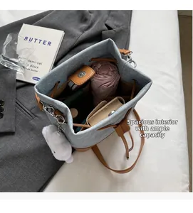 Top view of blue denim bucket bag interior showing ample storage and large capacity