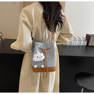 Blue denim bucket bag with brown leather trim and cute white cloud pendant decoration