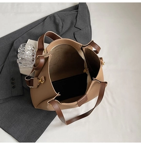 Top view showing large capacity interior and pebbled leather texture of this tote bag