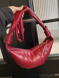 Retro burgundy croissant shoulder bag with pleated texture and stylish knotted strap