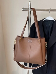 Brown lychee leather tote bag with wide detachable strap and golden hardware