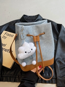 Blue denim bucket bag with brown leather trim and cute white cloud charm detail