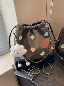 Canvas bucket backpack with colorful heart patches and plush cloud charm decor