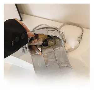 Macro view of woven handbag interior with wave edge flap and silver magnetic closure