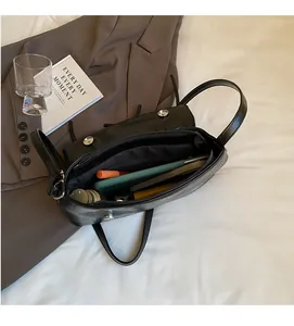 Interior detail of black ballet style bag showing spacious capacity for daily essentials