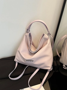 Lavender quilted tote backpack with heart-shaped metal details and versatile strap design