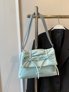 Mint green shiny wrinkled leather shoulder bag with chic double bow and ruched detail