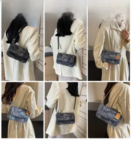 Detailed views of printed crossbody bags with chain straps in grey and blue color options