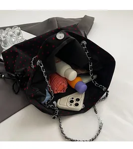 Spacious heart print tote interior showing capacity for umbrella, phone and essentials