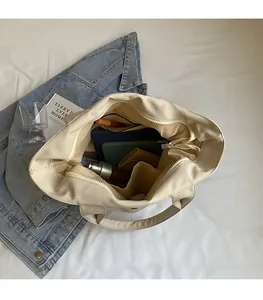 Top view of spacious canvas tote interior with pockets, showing large storage capacity
