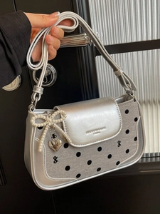 Polka dot canvas and silver leather underarm bag with pearl bow and heart charm