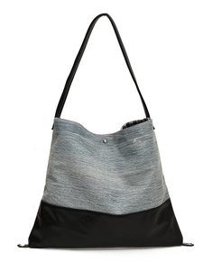 Large denim and black leather tote bag with silver magnetic snap and checkered lining