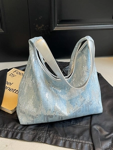 Light blue canvas tote with wave-patterned silver sequins and metallic silver strap