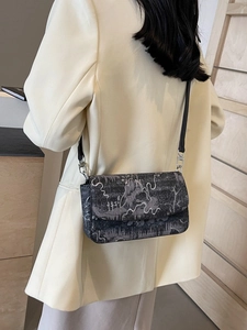 Chic grey crossbody bag with vintage landscape print and adjustable black shoulder strap