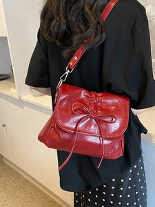 Vintage dark red pleated leather bucket bag with ribbon bow and adjustable strap