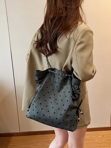 Grey large capacity tote bag with black polka dots and bows on silver chain strap