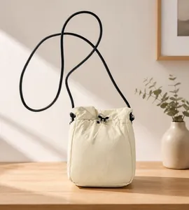 Top view of beige drawstring bucket bag showing storage capacity with an iPad mini
