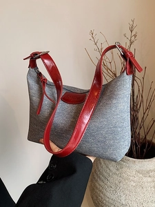 Grey canvas underarm bag with red leather strap and 'NO FILTER' patch detail