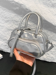 Chic silver metallic mini boston bag with dual handles and adjustable crossbody strap