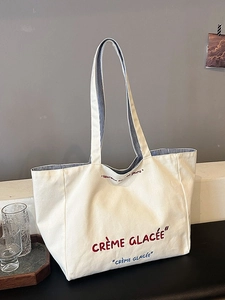 Large capacity cream canvas tote bag with red embroidery and blue striped lining