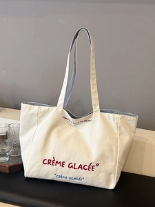 Large canvas tote bag with Crème Glacée embroidery and blue striped lining for daily use