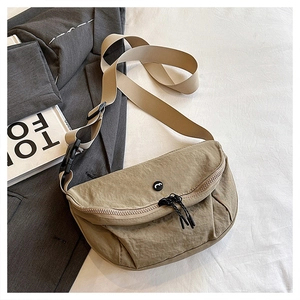 Detailed top view of a khaki moon-shaped crossbody bag with adjustable buckle strap