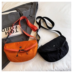 Detail of nylon crescent saddle bags with dual zippers and adjustable wide straps