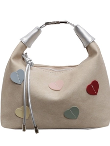 Chic beige heart-patterned suede handbag with metallic handles and colorful heart patches