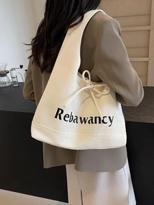 Minimalist cream white canvas tote bag with Rebawancy print and side drawstring detail