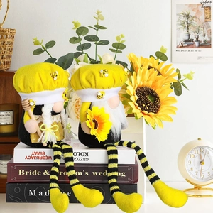 Pair of bumble bee themed faceless gnomes with long striped legs on home shelf