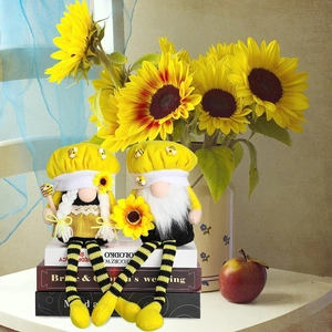 Set of two yellow bumblebee gnomes with sunflower accents and striped long legs for decor